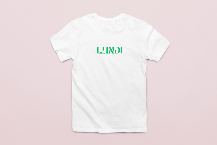 White unisex t-shirt with black “LUNDI” text, minimalist French design worn casually.